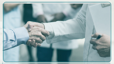 physician and insurance partner shaking hands